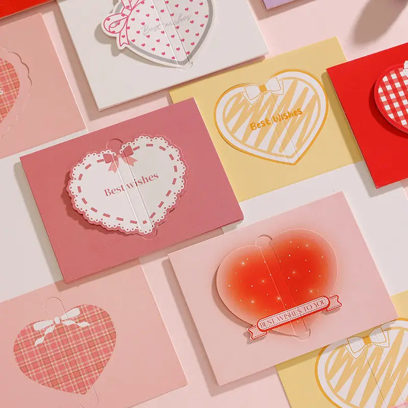 Pink heart shaped 3d greeting card with white lace edged cutout and pink ribbon bow from pastel Valentine wedding notes set.