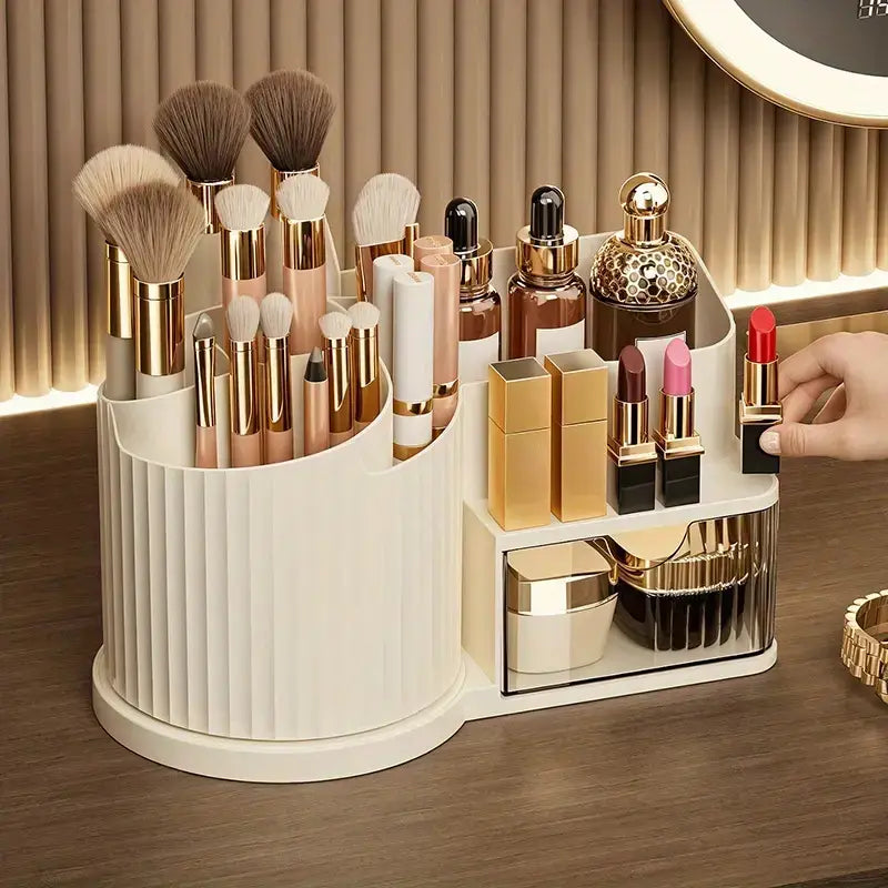 Cream-colored vertically ribbed plastic makeup organizer with brush holder featuring a mirrored compartment and gold-toned accents for large capacity skincare storage.