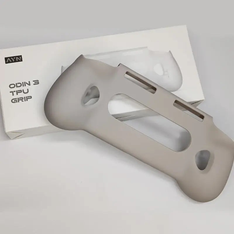 gray tpu grip for the ayn odin 3 featuring a sleek ergonomic design with cutouts and smooth contours for enhanced protection and comfort.