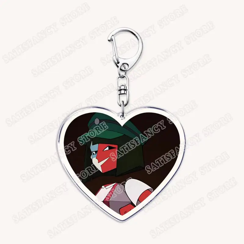 Herzförmiger Anime-Acryl-Schlüsselanhänger mit silberfarbenem Metallrahmen und Clip mit einer grünen und roten Illustration der animierten Figur aus „Hazbin Hotel“, ideal als Geschenk für Gamer.