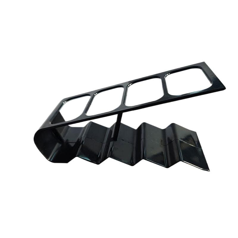 Black glossy metal remote control organizer desktop storage rack with a zigzag base and five rectangular cutouts.