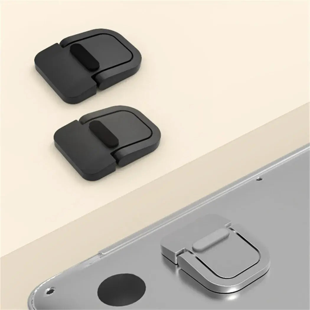 black plastic phone ring stand with a sleek minimalist design and soft grip pad attached to the back of a portable foldable laptop stand adjustable riser.