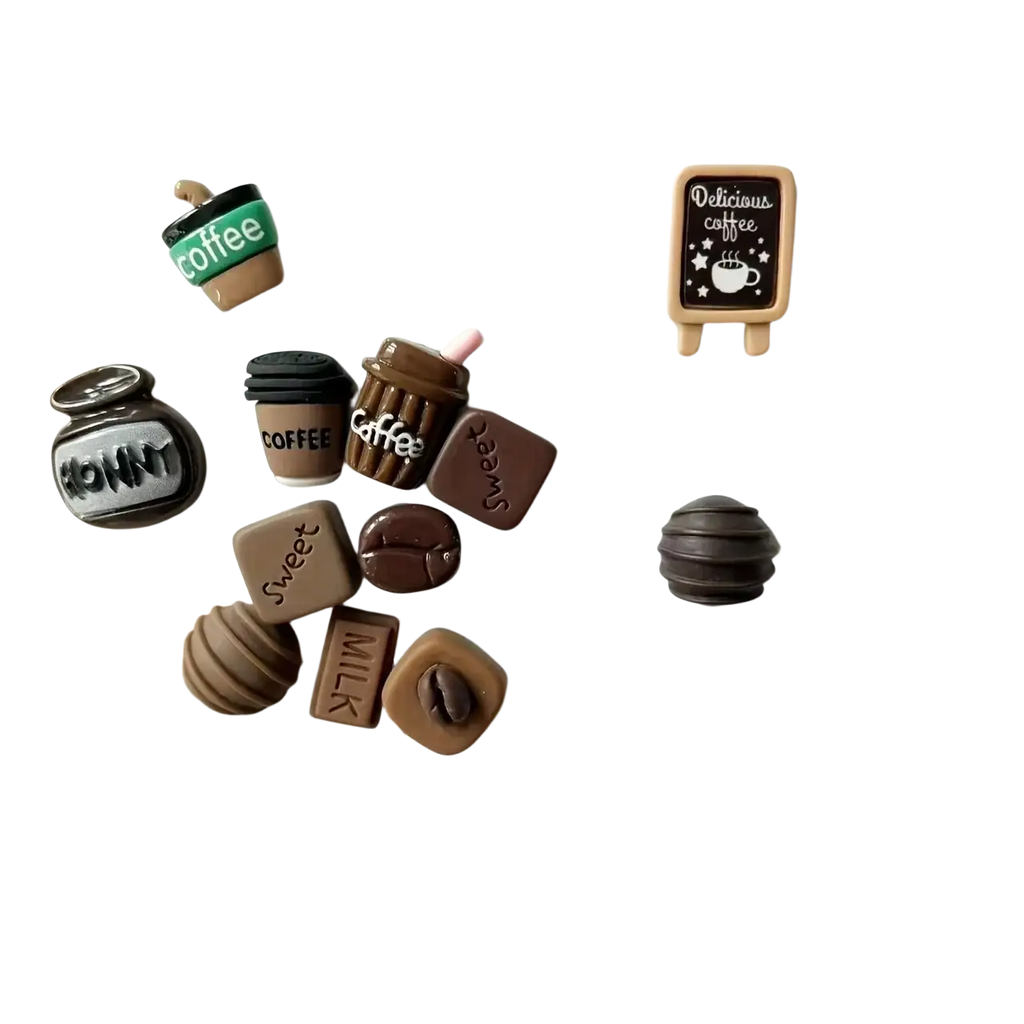 Brown and black miniature coffee-themed fridge magnets with cups beans and chalkboard sign designs in front view