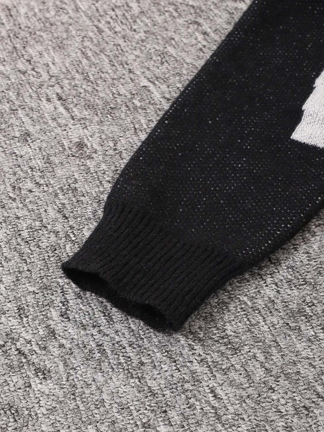 men black amazing graphic knit sweater sleeve showing black knitted material with white graphic design