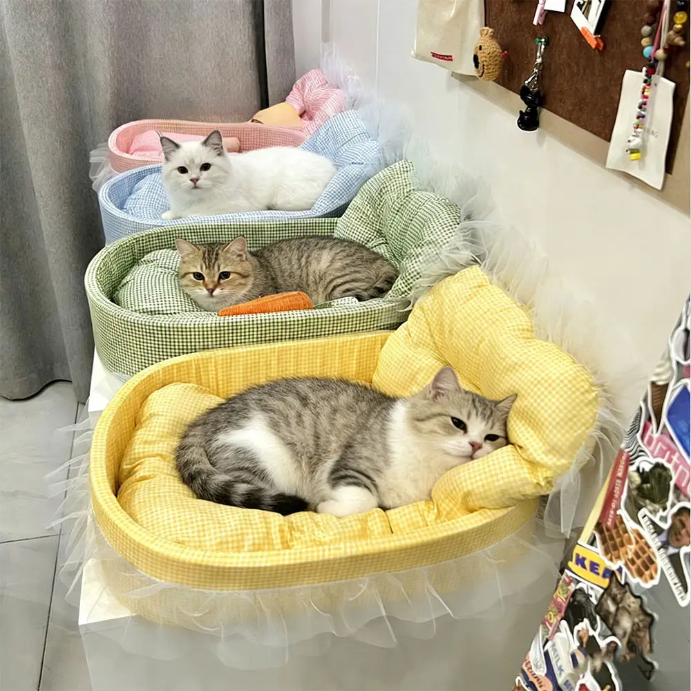 Yellow checkered plush cat sofa bed with a lace edge fluffy white tulle skirt for comfortable pet lounging.