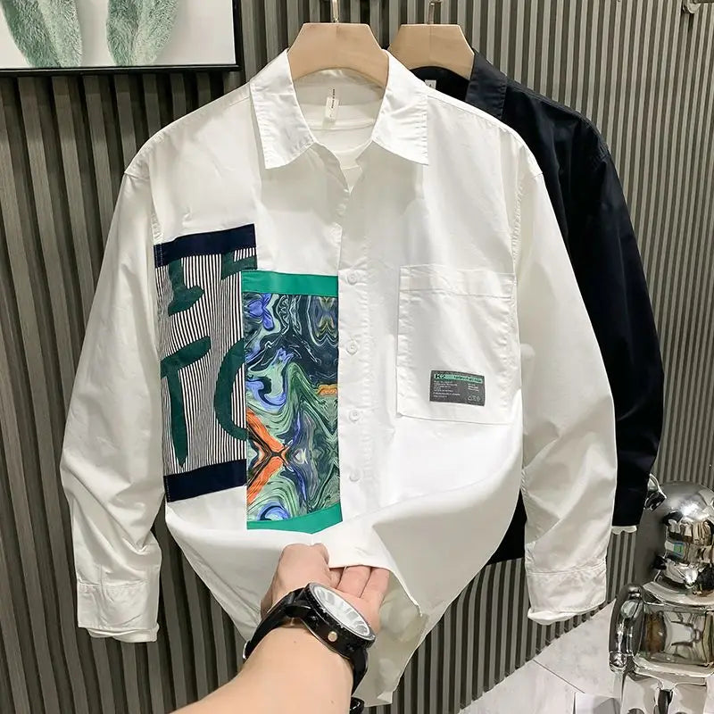 Men printed casual long sleeve shirt in white with a bold abstract graphic patch in green blue and orange on the left chest.