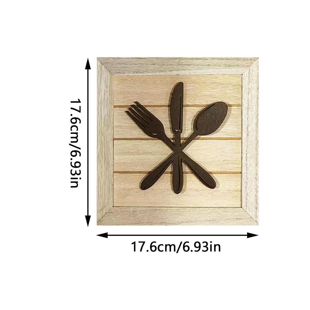 Tableau mural encadré mettant en scène un panneau rectangulaire en bois carré avec un ensemble d’ustensiles de cuisine en métal rustique brun foncé comprenant une fourchette, un couteau et une cuillère, disposés selon un motif en forme de X pour la décoration de cuisine.