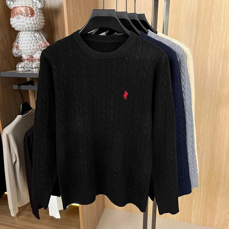 Black cable knit sweater for men featuring a red embroidered polo player logo on the left chest.