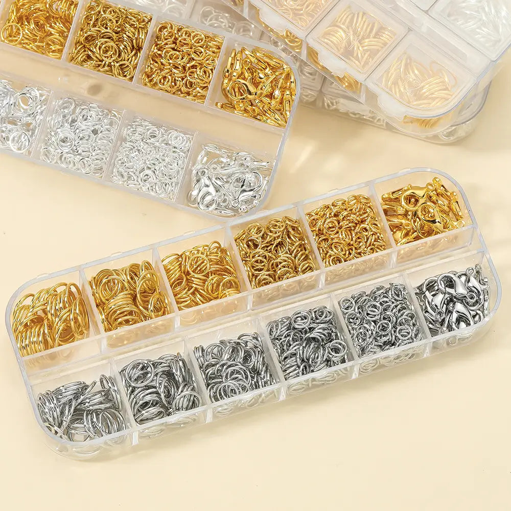 clear plastic organizer boxes filled with gold and silver metal jump rings and clasps for diy jewelry making findings kit with tools.