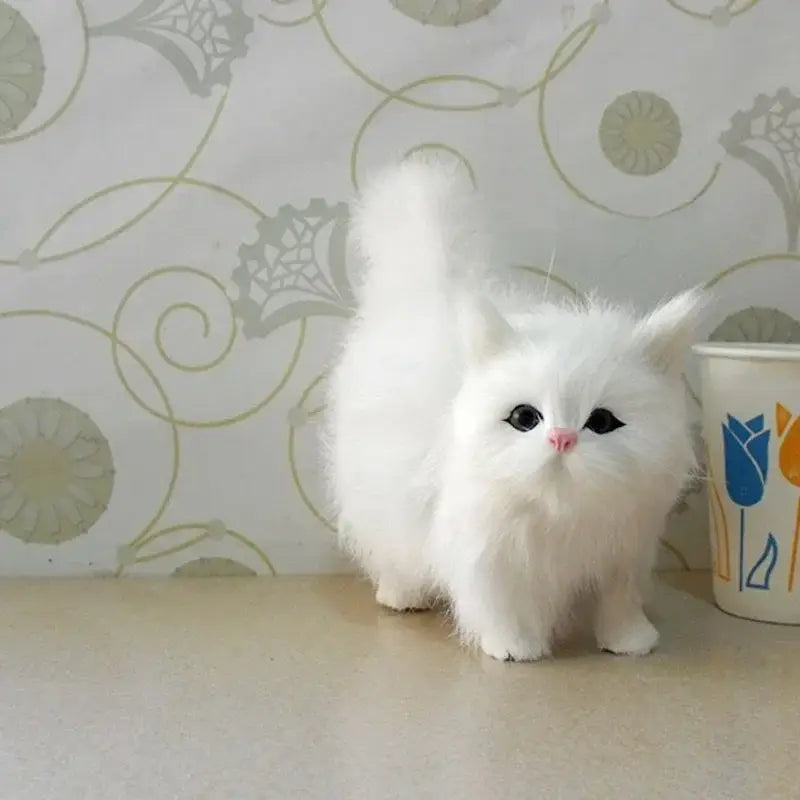 A fluffy white simulation cat plush soft stuffed animal toy with black eyes and a pink nose.