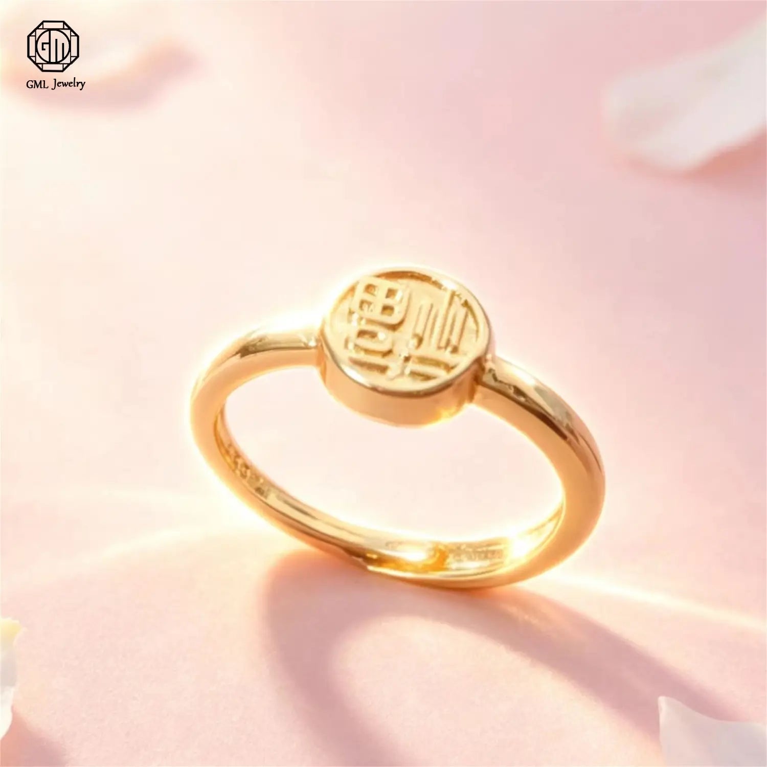A delicate sand gold adjustable gold ring with a matte wide band featuring a circular face engraved with Chinese characters crafted from polished fade resistant metal.