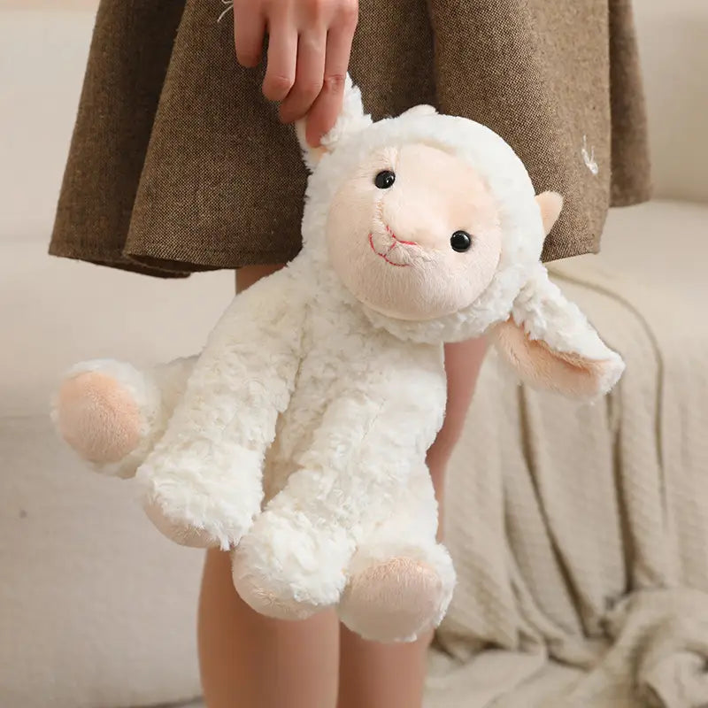A soft plush white lamb stuffed animal toy measuring 25cm with pink inner ears and feet made from plush material.