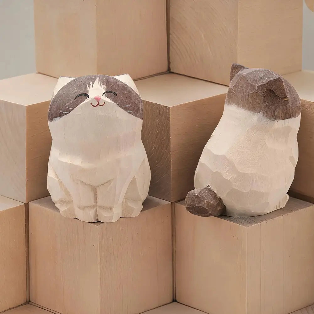 Two handcrafted wooden cat figurines in natural wood color with one showing a smiling face and the other featuring the back side as factory direct actual product desk decor.