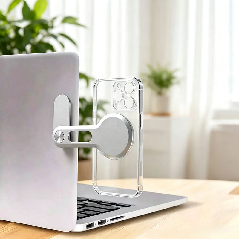 Klarer Telefonhalter mit silberner Aluminium-Magnetbasis, die eine transparente Hülle für die iPhone-Nutzung magnetisch hält, für die Verwendung auf einem Aluminium-Ständer am Laptop