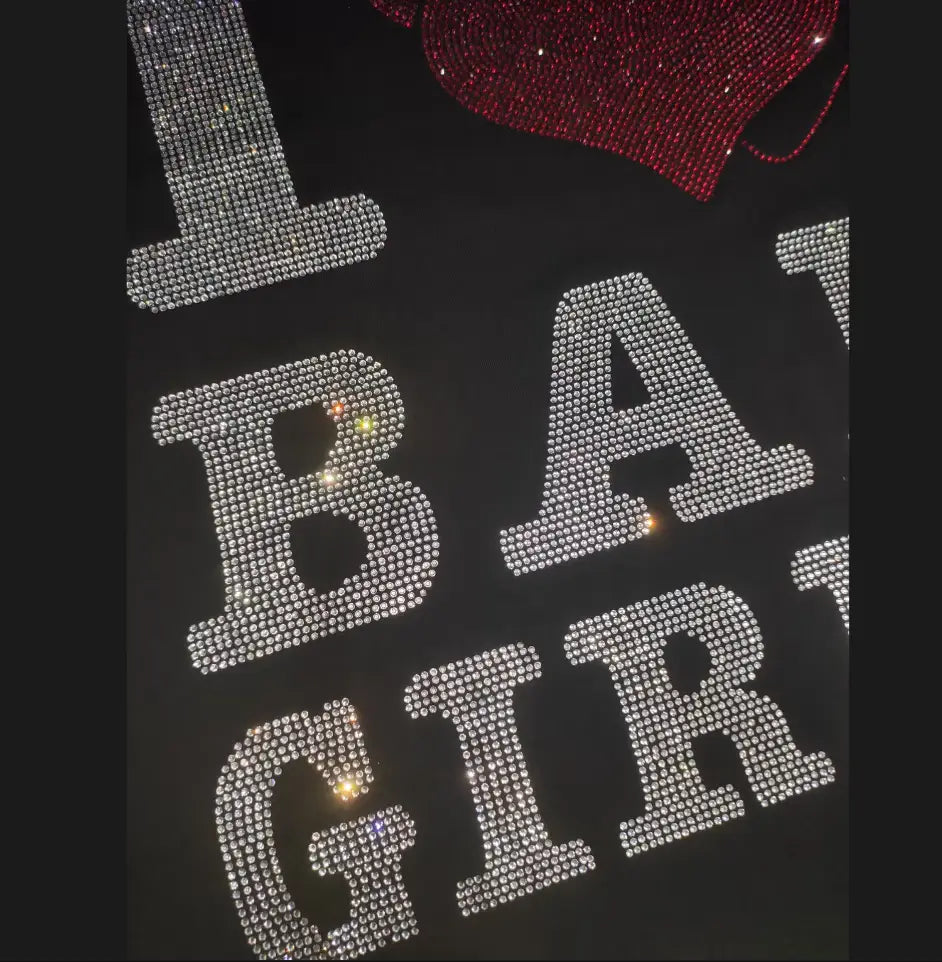 Men rhinestone devil bear graphic tee in black featuring sparkling silver rhinestones spelling i bar girl and a red heart-shaped embellishment.