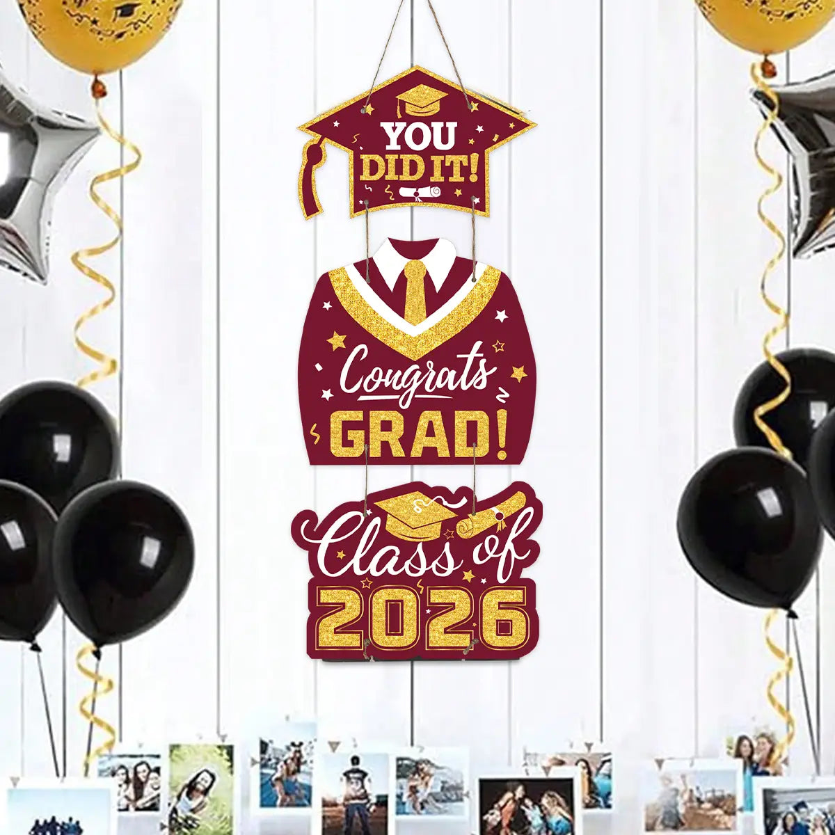 class of 2026 graduation door hanging decor featuring a maroon and gold glittery banner with congratulations text and graphics of a graduation cap gown and diploma.