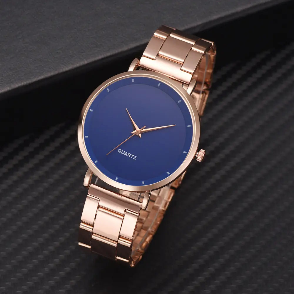 Rose gold women luxury watch quartz business wristwatch featuring a rose gold-tone stainless steel band with a sleek round blue dial and minimalist hour markers.