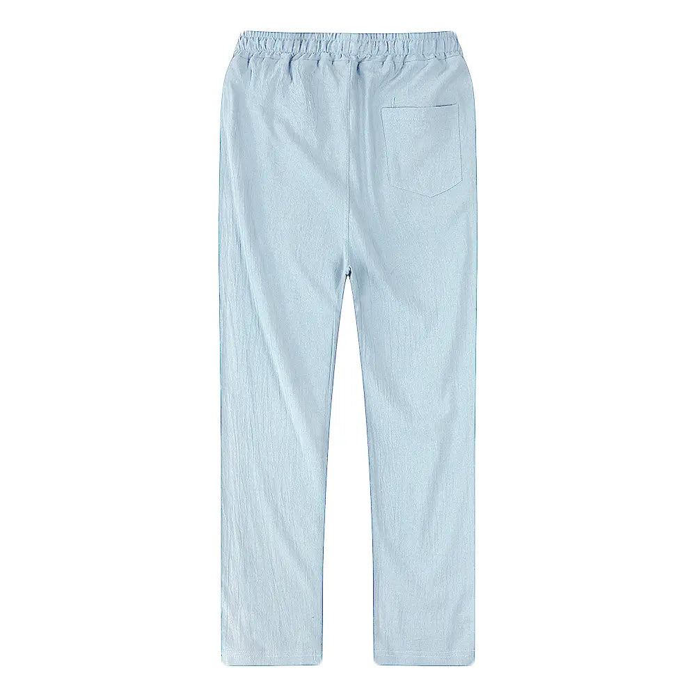 light blue cotton linen trousers for men shown from the back with loose fit elastic waistband and a single back pocket designed for breathable casual wear.