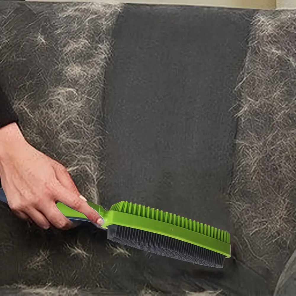 Silicone pet hair remover brush in green and black with a sleek ergonomic design for effective pet hair removal.