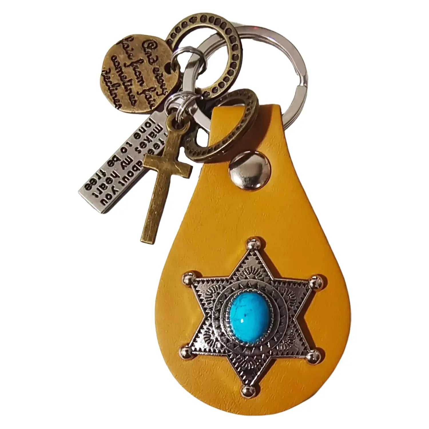Yellow leather keychain with a turquoise stone set in an ornate silver star badge and dangling charms including a cross, engraved metal tag, and circular medallion for gift giving.