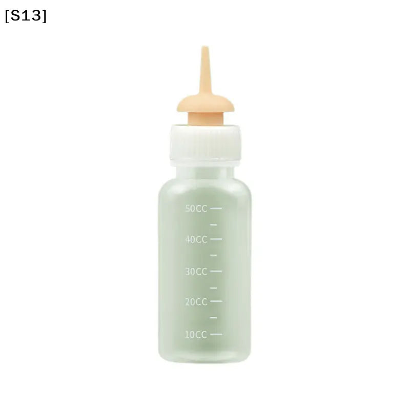 Transparent plastic cat bottle feeder with a white cap, beige nipple, and measuring scale, featuring a unique design for feeding newborn pets.