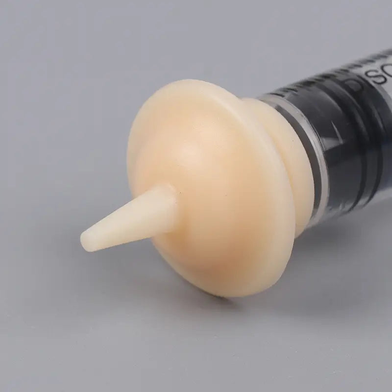 beige silicone syringe plunger with tapered tip for pet oral syringe available in 1ml 3ml 5ml designed for precise feeding and medication.