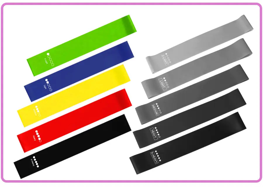 Set of colorful resistance bands in green blue yellow red black and gray with white branding from the purple resistance bands set for home fitness.