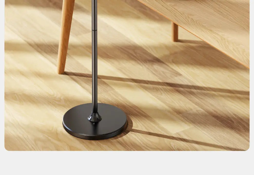 Black metal floor lamp base with circular design supporting aluminum alloy tablet and phone floor stand.