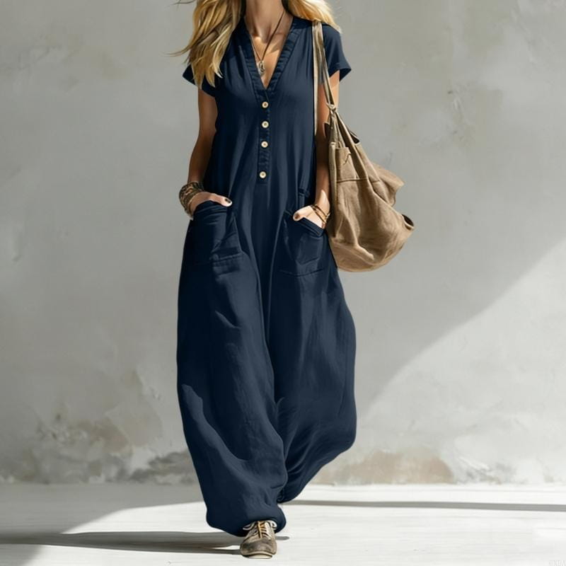 Navy blue button-front jumpsuit with wide-leg pants and front pockets made from comfortable fabric for women.