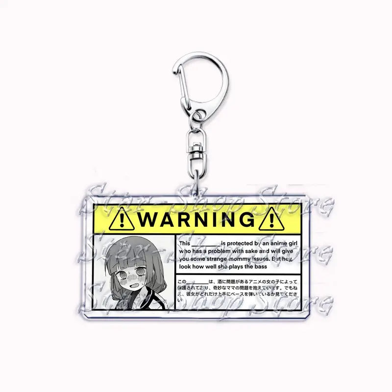 Clear acrylic keychain featuring a black and white anime character illustration with a yellow warning label and English and Japanese text from Bocchi the Rock.