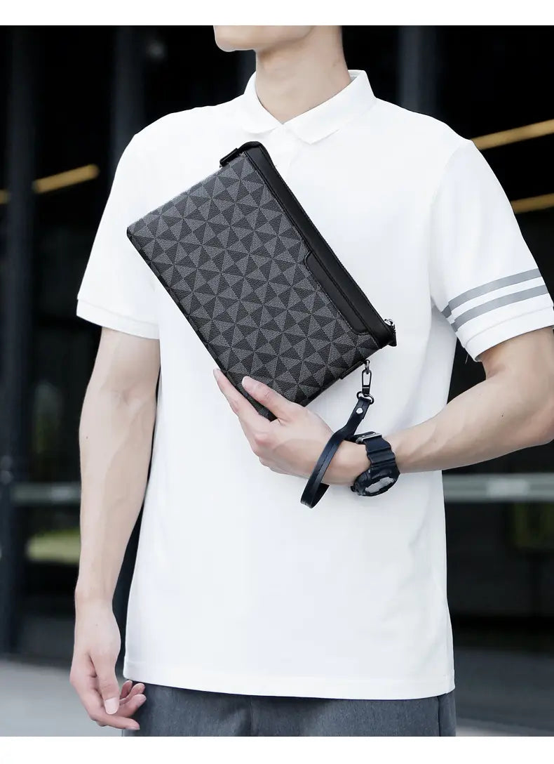 Black pu leather men clutch bag with geometric pattern and zipper closure showing a pocket interior.