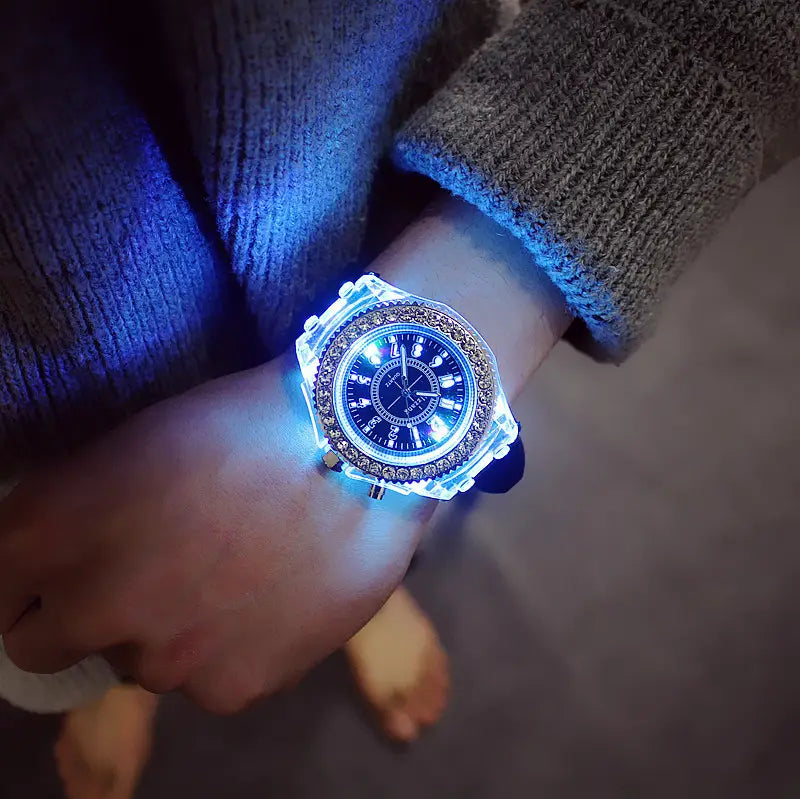 A led luminous silicone watch rhinestone digital timepiece with a glowing blue led, transparent case, crystal-encrusted bezel, and illuminated dial.