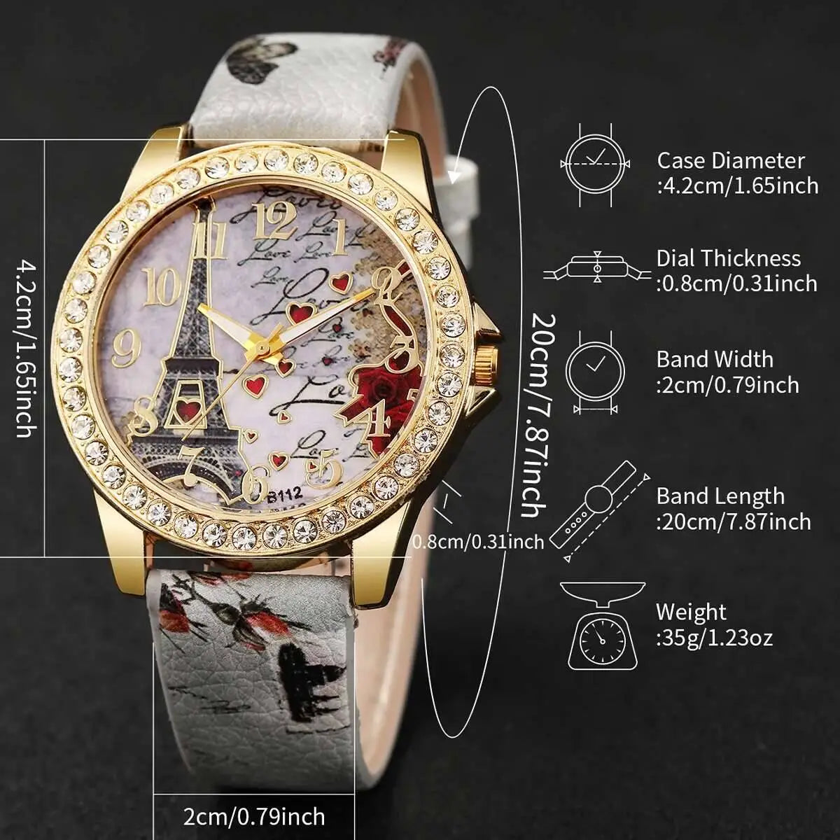 Gold-toned Eiffel Tower Floral Quartz women watch with crystal-encrusted bezel and pale lavender dial featuring ornate Eiffel Tower design, red hearts, and cursive script.