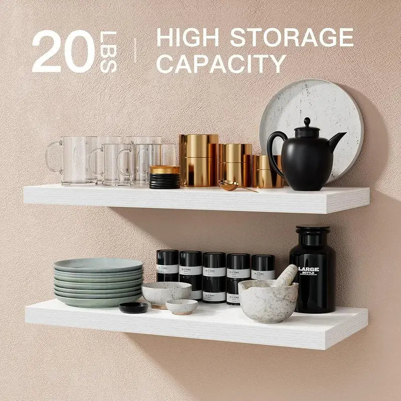 white floating shelves with a minimalist design made of wood displaying glass mugs, gold canisters, and ceramic plates for living room wall display