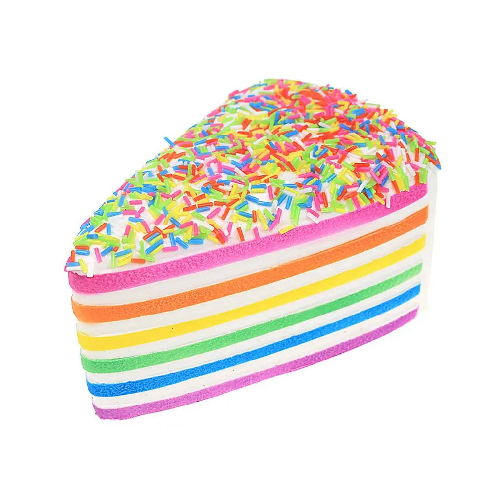 Jouet antistress à gâteau arc-en-ciel à rebond lent, tranche en silicone à rebond lent, rayée arc-en-ciel, avec des vermicelles colorés sur le dessus, conçu comme jouet antistress.