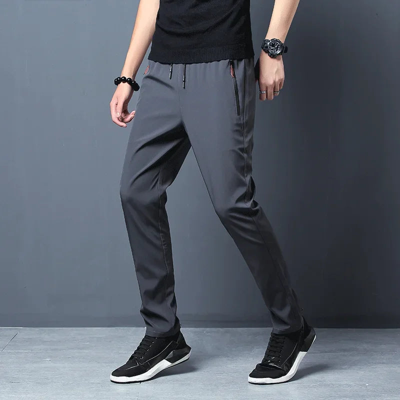 Men’s casual slim joggers in dark gray with a sleek slim-fit design and subtle side pockets.