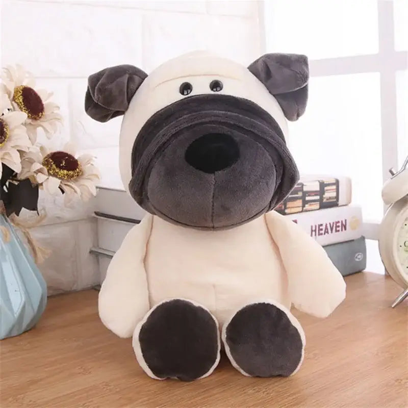 Un perro de peluche blanco y negro, hecho de material suave tipo terciopelo, con ojos bordados, de la colección de león, elefante y tigre.