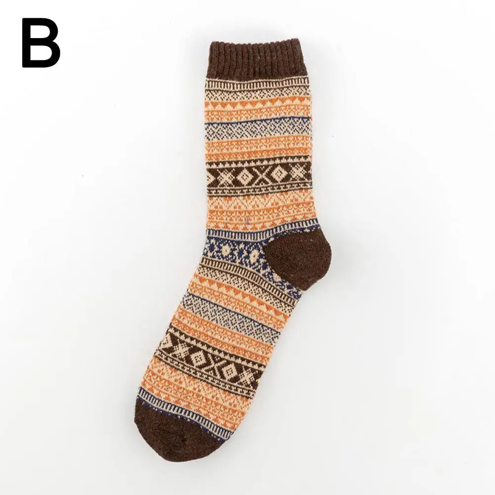 Men retro cotton crew socks mid-high tube thermal teal featuring a cozy knitted design with warm orange brown and cream stripes and geometric patterns reflecting a fashion trend.