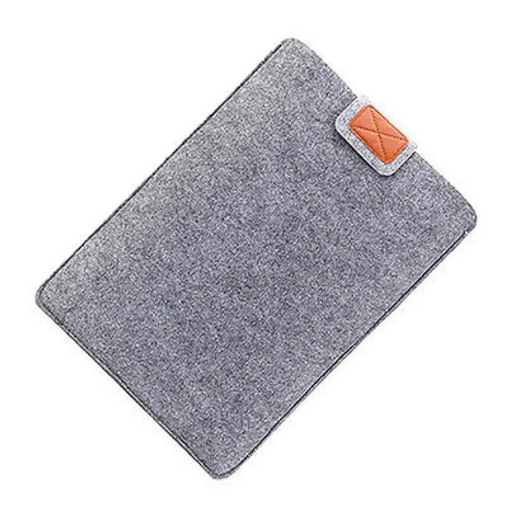 gray felt laptop bag sleeve for macbook air with tan leather patch featuring x-stitched design suitable as a tablet bag