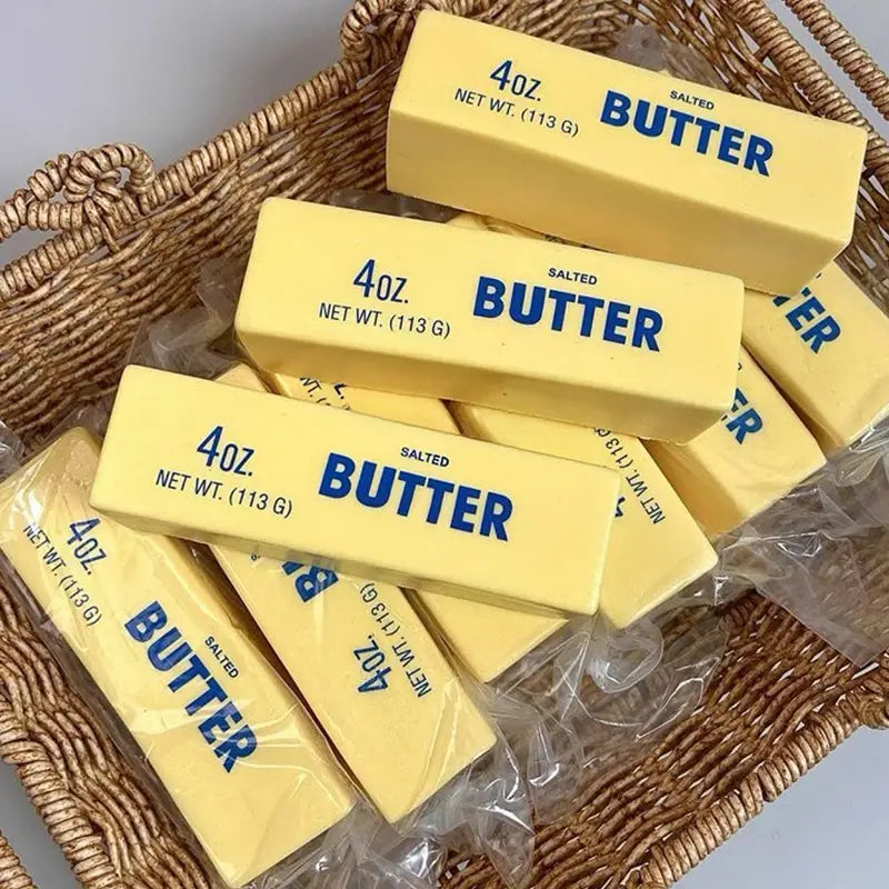 Yellow salted butter sticks labeled four ounces each in a slow rising butter stick stress relief toy product.