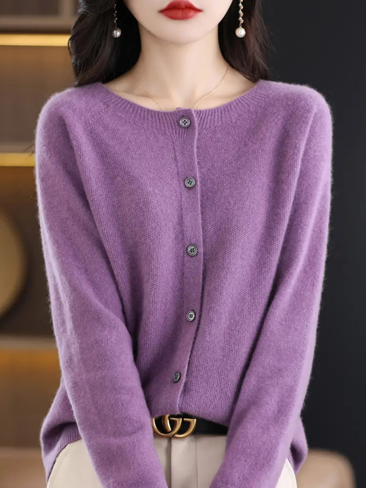 A soft lavender merino wool cardigan for women with a round neckline and button closure featuring cashmere knit sweater detailing.