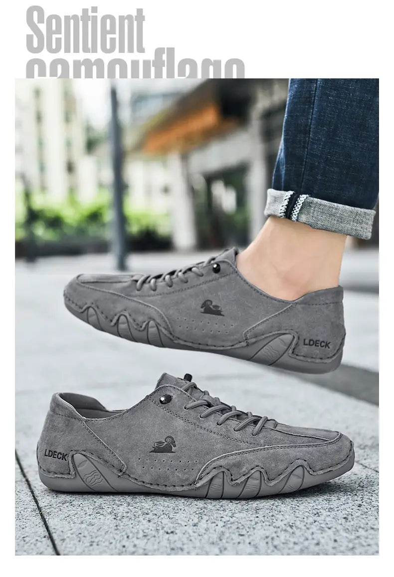Men high top leather casual sneakers in gray suede with lace-up design featuring a subtle duck logo and ldeck branding on the side.