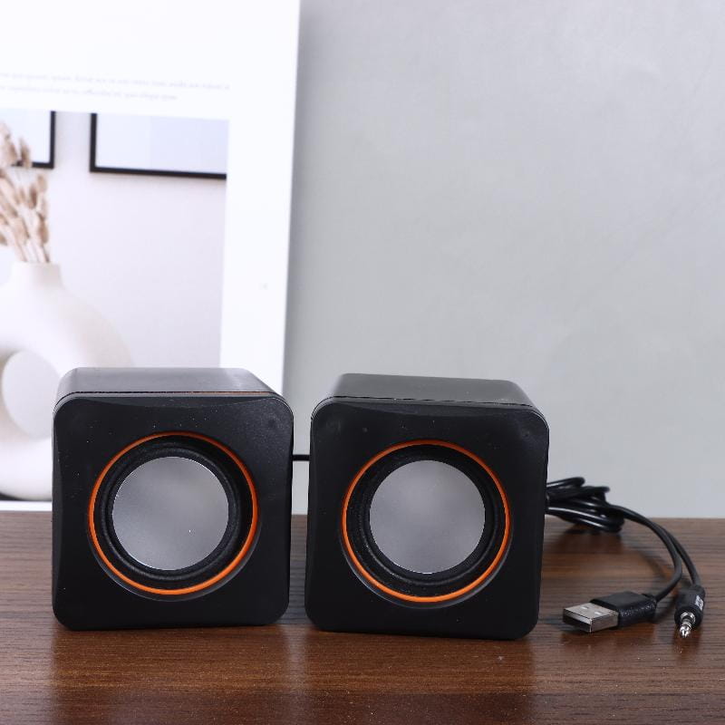 black and orange cube-shaped usb computer speakers with matte finish featuring led stereo audio for desktop pc use
