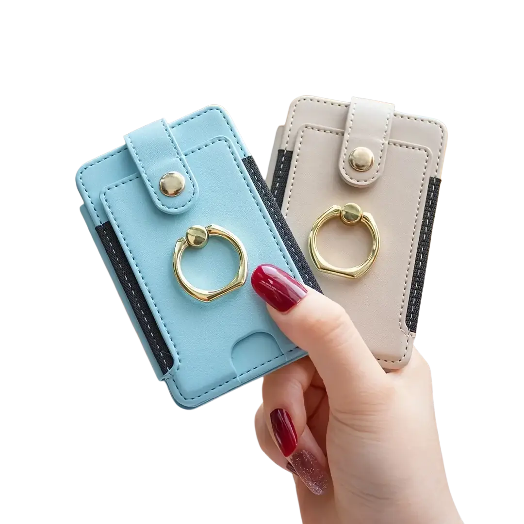 Light blue and beige leather universal ring small card holders with gold-tone ring finger loops shown from front angle