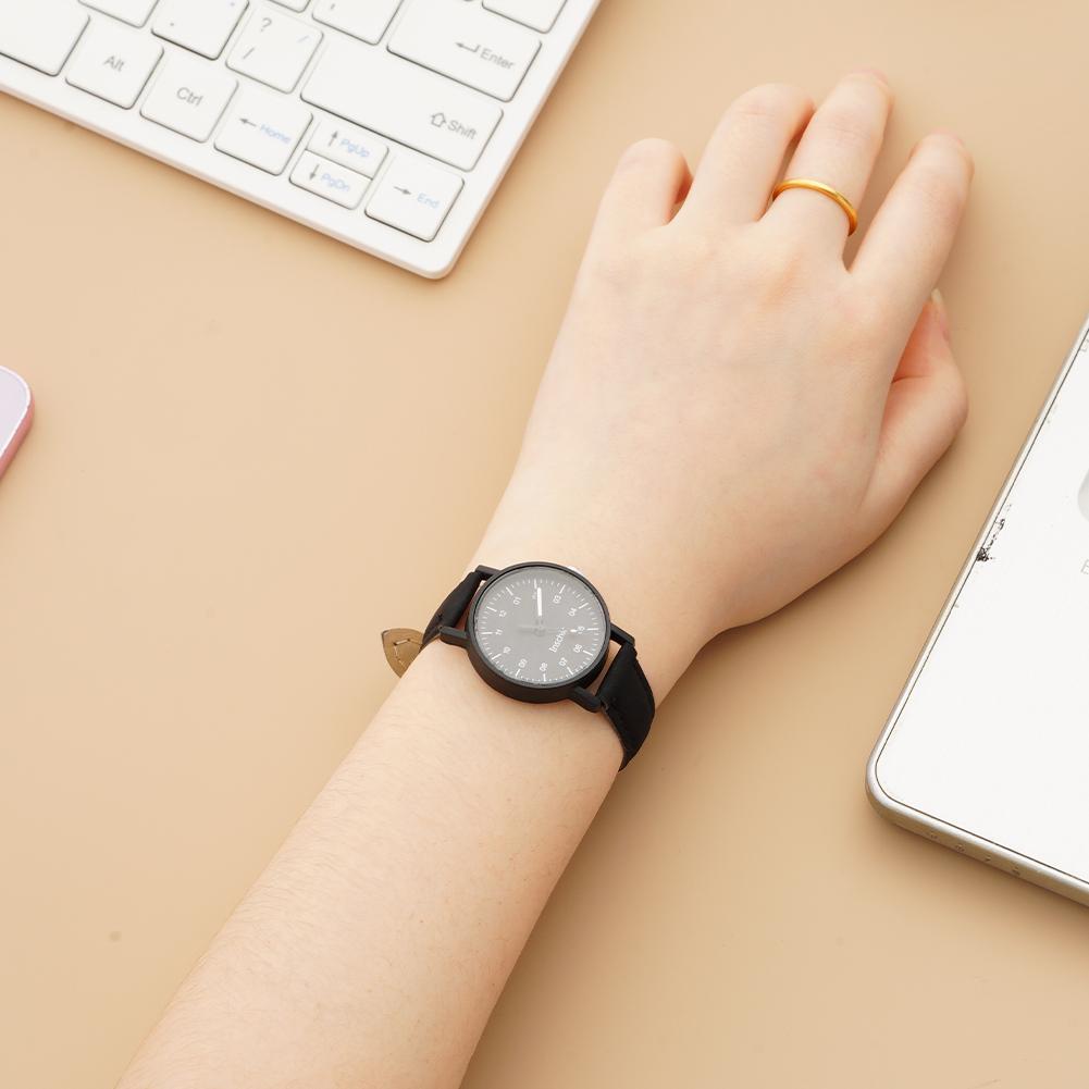 Women quartz watch with black pu leather strap minimalist dial and gold-tone accent on the side waterproof wristwatch