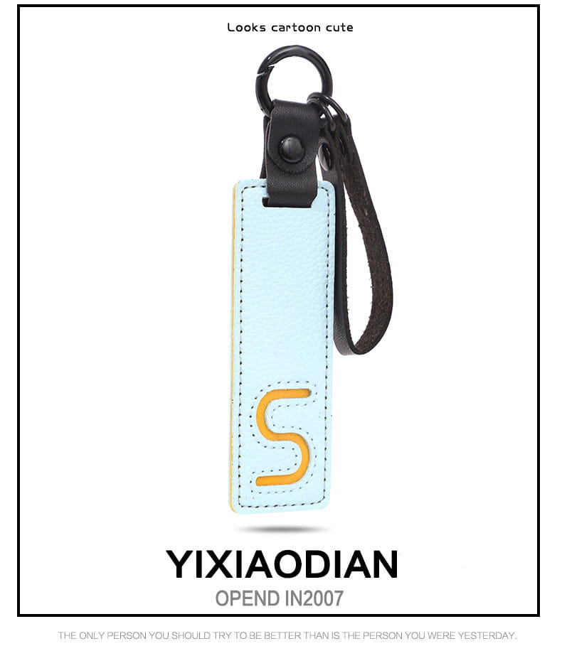 Light blue leather letter keychain with stitched orange s and black strap as an alphabet pendant party gift.