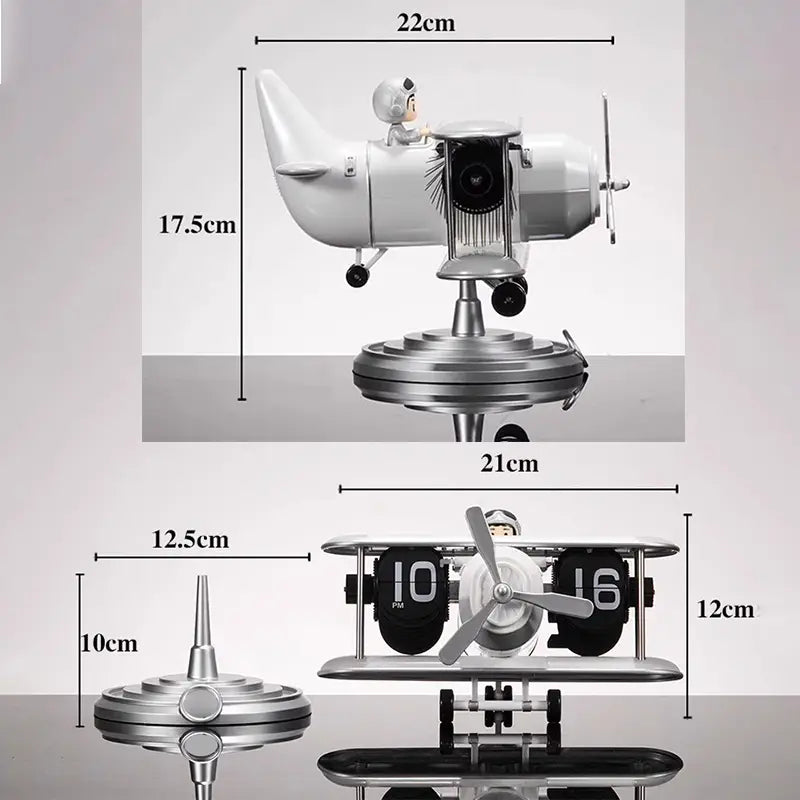 Silver airplane-shaped desk clock with a pilot figure and black flip-digit display vintage table decor.