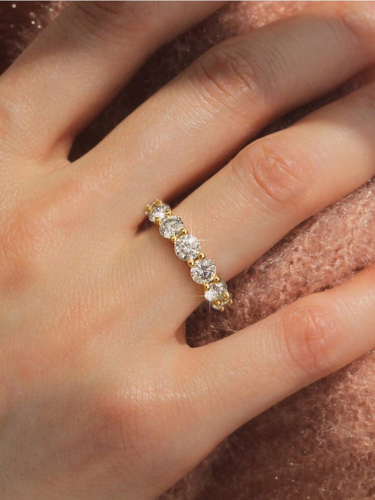 Sterling silver zircon ring for women featuring a delicate gold band with five round-cut diamonds set in a sleek continuous line.