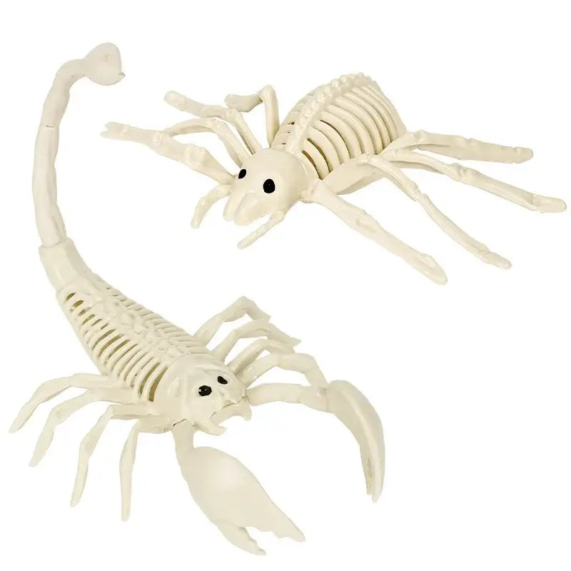 Two off-white plastic scorpion figurines with black eyes and articulated limbs from a halloween animal skeleton props set.