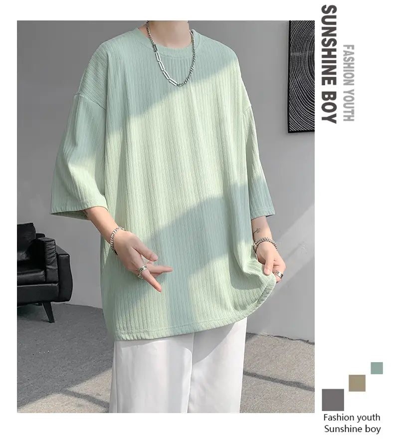 Men striped oversized summer t shirt in light green ribbed cotton with a relaxed fit and three quarter sleeves.